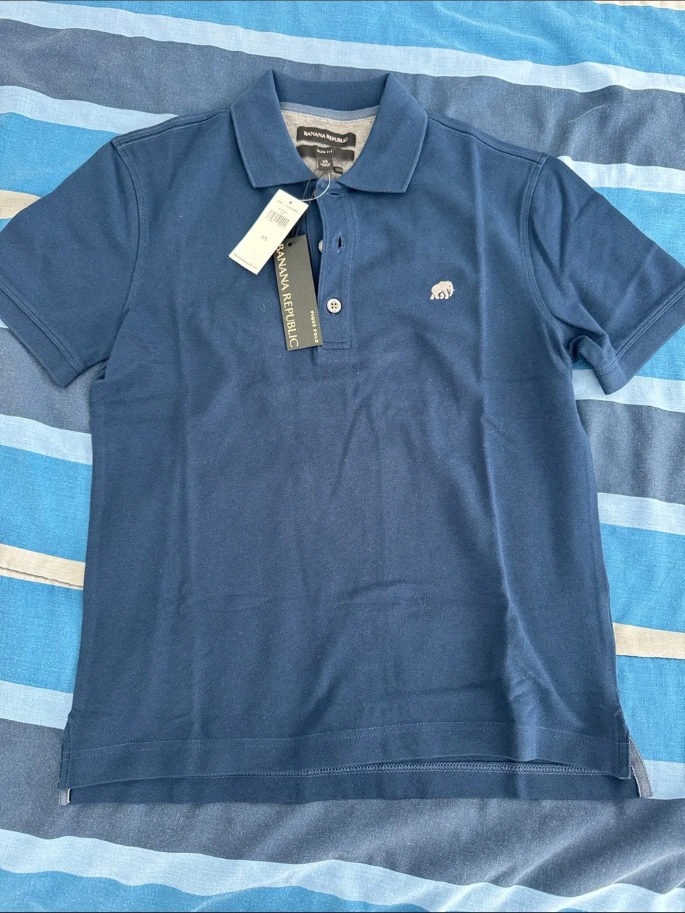 Banana Republic Men’s Dark Blue Polo with Ivory Elephant Logo